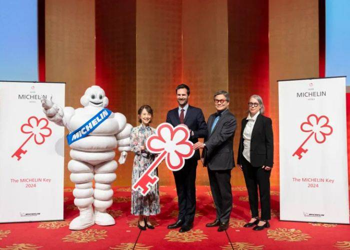 The announcement of the Michelin Key, with the Michelin man and a large "key" printout.